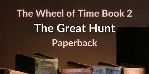 Old books on a brown background. Brown and white typography reads “The Wheel of Time Book 2: The Great Hunt Paperback.”