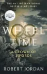 A Crown of Swords paperback, Orbit's September 2021 edition. The cover depicts the ruins of a wall.