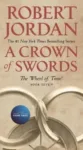 A Crown of Swords paperback, February 2020 mass-market edition from Tor Books. The cover has the snake-wheel symbol on a sand-brown background.
