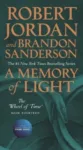 A Memory of Light paperback, June 2020 mass-market edition from Tor Books. The cover has the snake-wheel symbol on a dark green background.