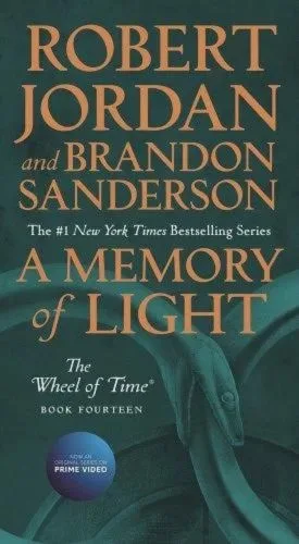 A Memory of Light paperback, June 2020 mass-market edition from Tor Books. The cover has the snake-wheel symbol on a dark green background.