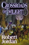 Crossroads of Twilight hardcover, January 2003 edition from Tor Books. The cover has Mat Cauthon and his group on horseback, weapons raised.