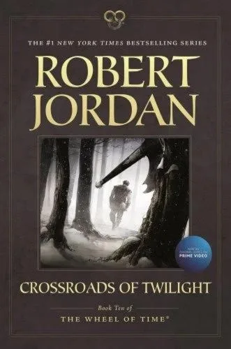 Crossroads of Twilight paperback, June 2014 edition from Tor Books. The cover features Perrin walking away from his axe, which is buried in a tree trunk.