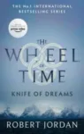 Knife of Dreams paperback, Orbit's September 2021 edition. The cover depicts snow-tipped mountains and a silvery sky.