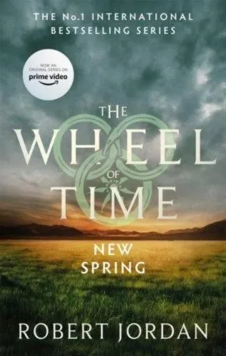 New Spring paperback, Orbit's September 2021 edition. The cover depicts a grassy plain with mountains on the horizon.