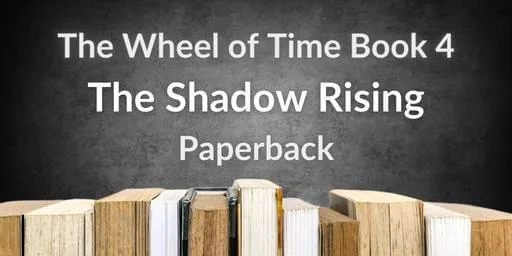 Books on a gray background. Gray and white typography reads “The Wheel of Time Book 4: The Shadow Rising Paperback.”
