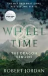 The Dragon Reborn paperback, Orbit's September 2021 edition. The cover depicts the tops of trees with a stone fortress in the distance.