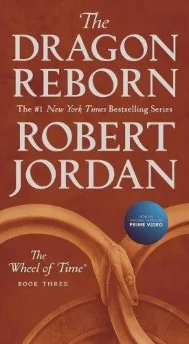 October 2019 mass-market edition of The Dragon Reborn from Tor Books. The cover has the snake-wheel symbol on a cardinal red background.