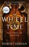 The Fires of Heaven paperback, Orbit's September 2021 edition. The cover depicts a wooden door with a stone border.