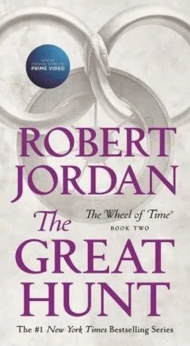 The Great Hunt paperback, October 2019 mass-market edition from Tor Books. The cover has the snake-wheel symbol on a white/gray background.