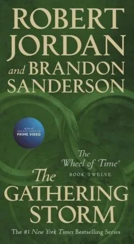 The Gathering Storm paperback, April 2020 mass-market edition from Tor Books. The cover has the snake-wheel symbol on a green background.