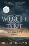 The Shadow Rising paperback, Orbit's September 2021 edition. The cover depicts dark clouds hanging over a rocky desert.