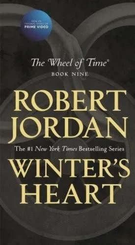 Winter's Heart paperback, February 2020 mass-market edition from Tor Books. The cover has the snake-wheel symbol on a black background.