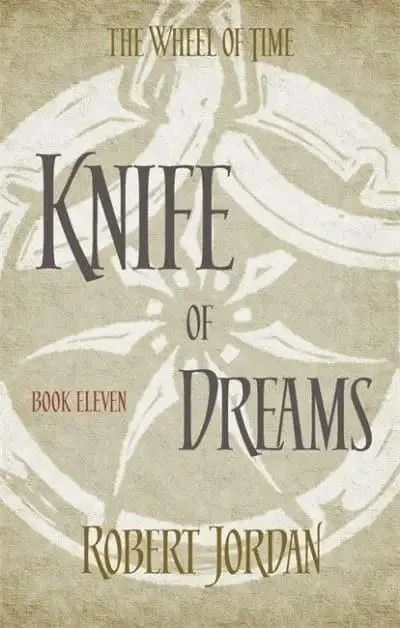 Knife of Dreams paperback, Orbit's 2014 edition. The cover has the snake-wheel symbol on an alabaster background.