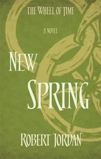New Spring paperback, Orbit's 2014 edition. The cover has the snake-wheel symbol on a meadow green background.
