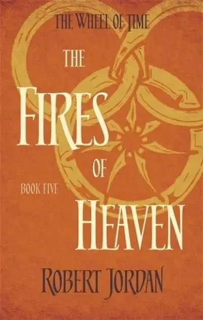 The Fires of Heaven paperback, Orbit's 2014 edition. The cover has the snake-wheel symbol on an orange background.