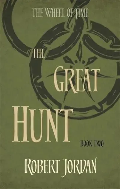 The Great Hunt paperback, Orbit's 2014 edition. The cover has the snake-wheel symbol on a forest green background.