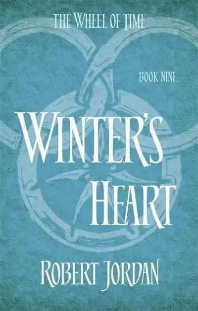 Winter's Heart paperback, Orbit's 2014 edition. The cover has the snake-wheel symbol on an aqua background.