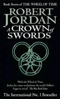 A Crown of Swords paperback. Time Warner Books UK's 1997 edition. The cover has a green snake-wheel symbol on a black background.