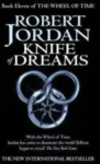 Knife of Dreams paperback. Orbit's 2006 edition. The cover has a silver snake-wheel symbol on a black background.