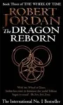 The Dragon Reborn paperback. Time Warner Books UK's 1992 edition. The cover has a bronze snake-wheel symbol on a black background.