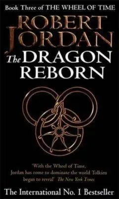 The Dragon Reborn paperback. Time Warner Books UK's 1992 edition. The cover has a bronze snake-wheel symbol on a black background.