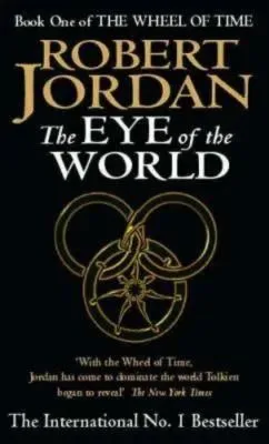 The Eye of the World paperback. Orbit's 1991 edition. The cover has a yellow snake-wheel symbol on a black background.