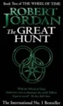 The Great Hunt paperback. Time Warner Books UK's 1992 edition. The cover has a green snake-wheel symbol on a black background.