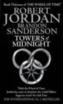 Towers of Midnight paperback. Orbit's 2011 edition. The cover has a silver snake-wheel symbol on a black background.