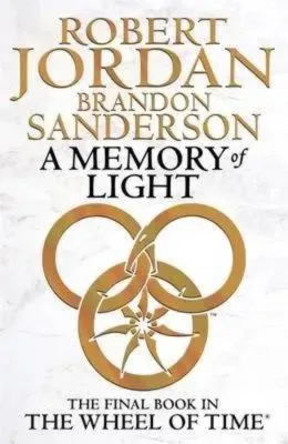A Memory of Light paperback, January 2013 edition from Orbit. The cover has a gold snake-wheel symbol on a white parchment effect.