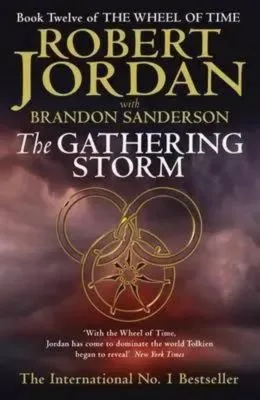 The Gathering Storm paperback, October 2009 edition from Orbit. The cover has a gold snake-wheel symbol on a stormy background.