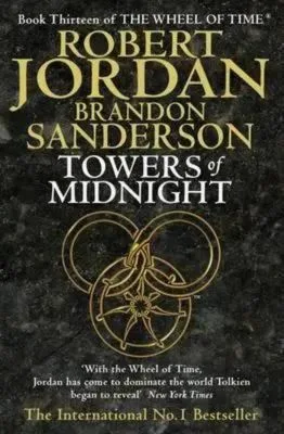 Towers of Midnight paperback, November 2010 edition from Orbit. The cover has a gold snake-wheel symbol on a charcoal background.