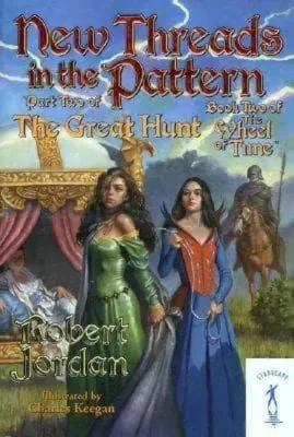 New Threads in the Pattern paperback, January 2004 edition from Starscape. The cover has Egwene being held by a leash.