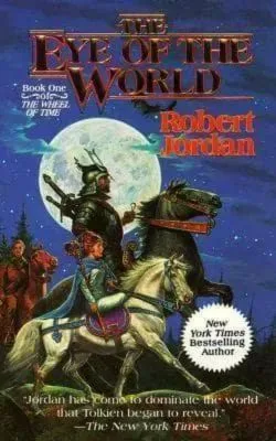 The Eye of the World paperback, November 1990 mass-market edition from Tor Books. The cover has Moiraine and Lan on horseback with Rand following behind.