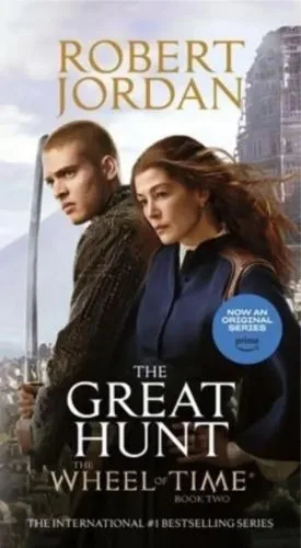 The Great Hunt paperback, 2023 media tie-in mass-market edition from Tor Books. The cover features Josha Stradowski as Rand al'Thor and Rosamund Pike as Moiraine Damodred.